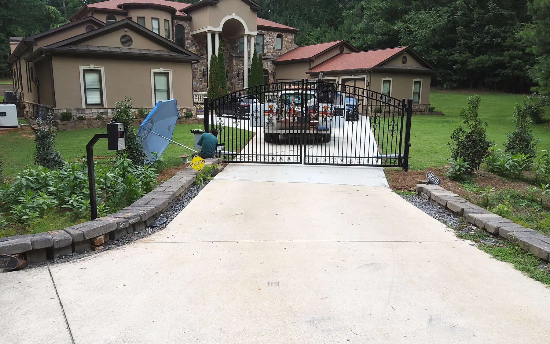 Gate Doctor technician performing preventative maintenance on an automatic gate